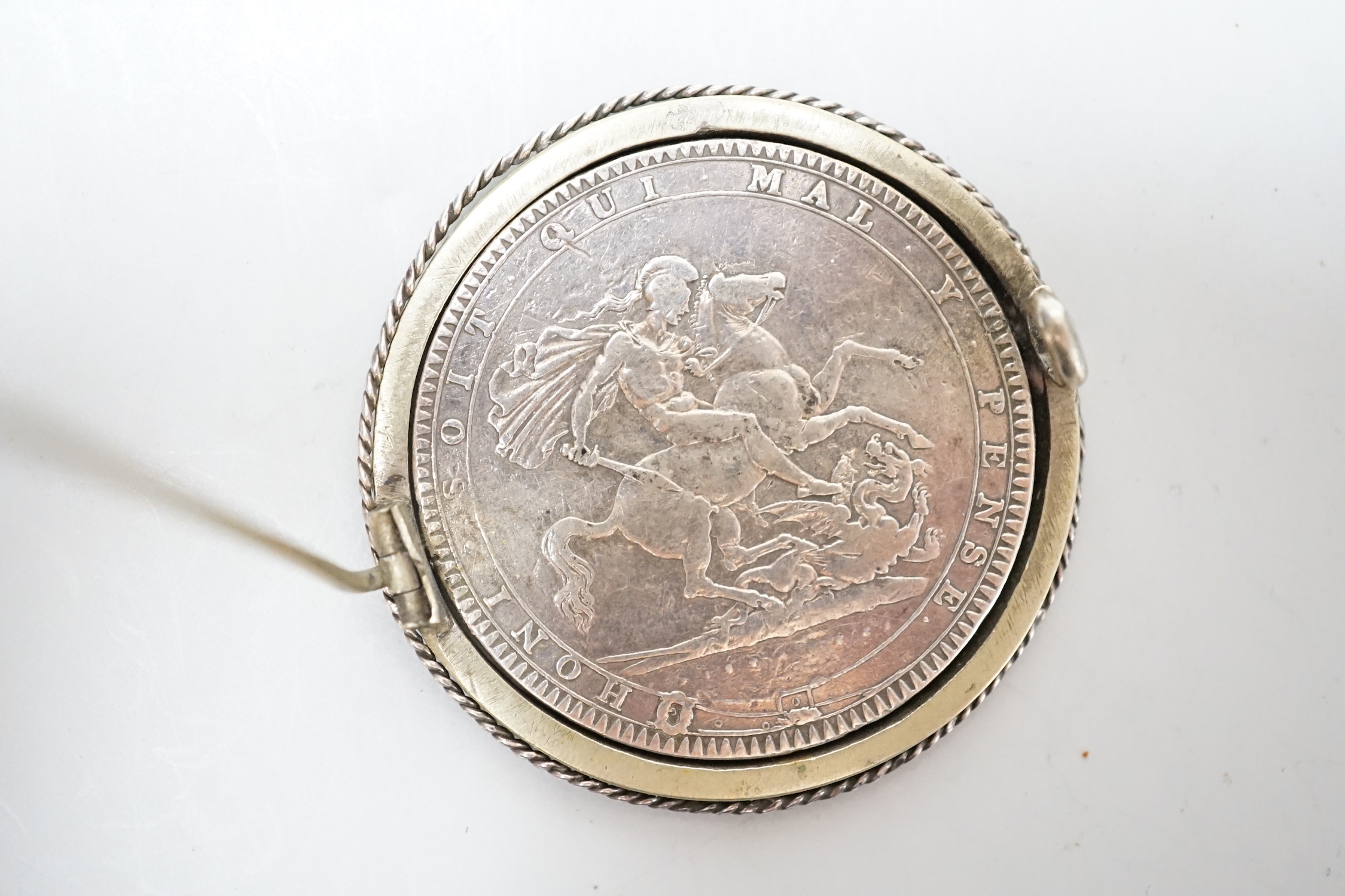 An 1819 crown mounted as a swivel brooch